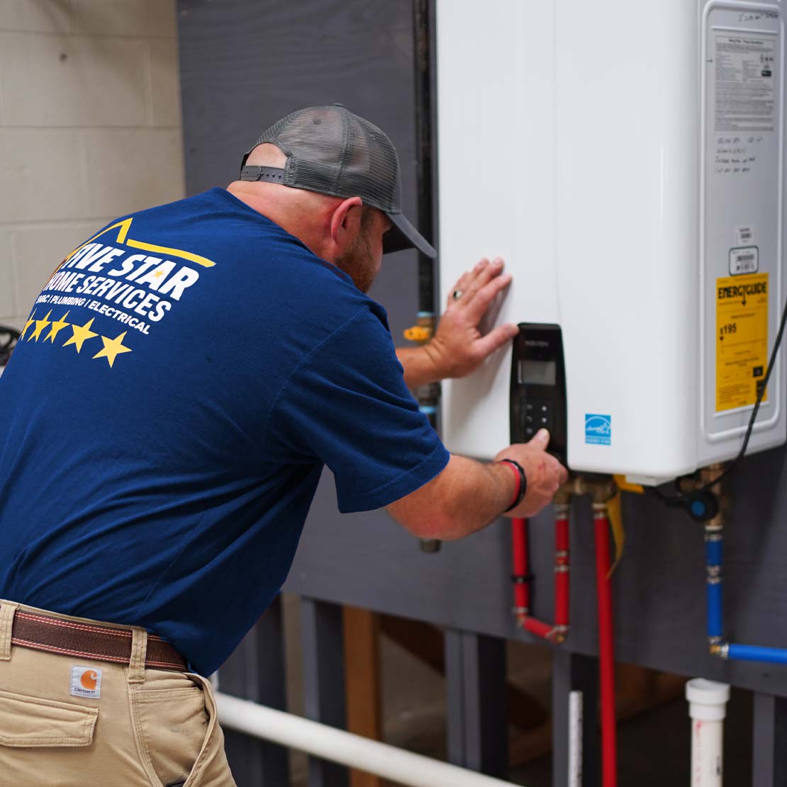 Plumber Operating a Tankless Water Heater