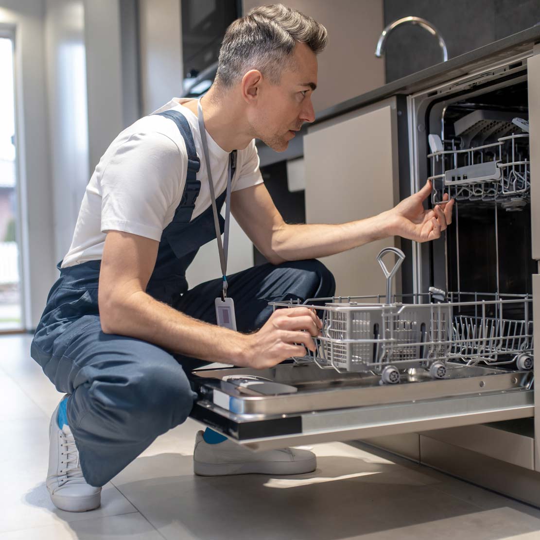 Plumber Installing a Dishwasher