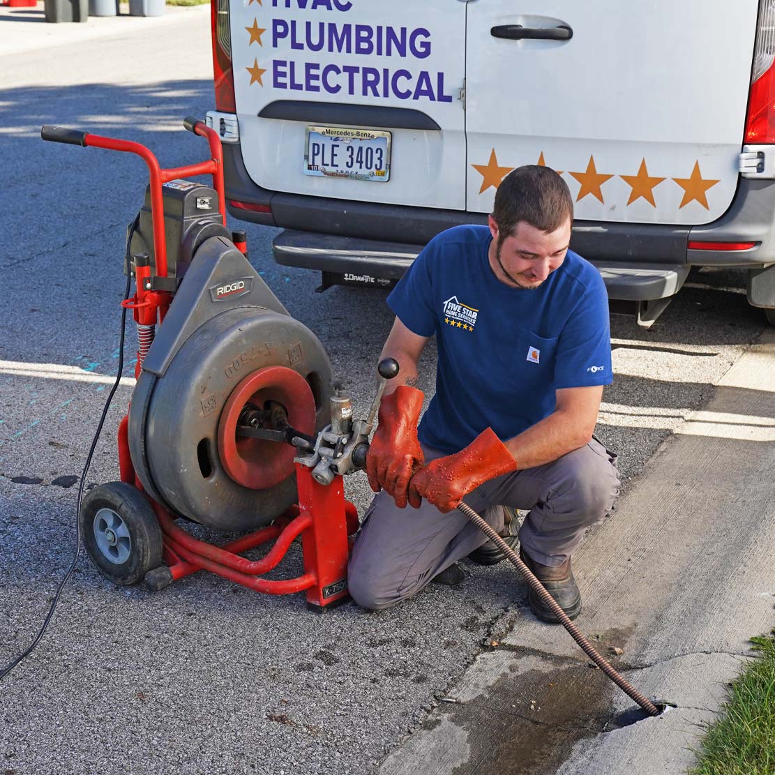 Plumber with a Hydro Jetting Machine